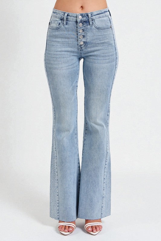 Light blue flared jeans on a white background