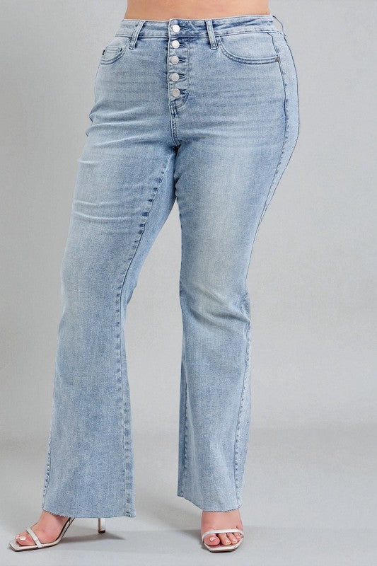 Light blue jeans worn by a person on a gray background