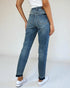 Person wearing blue jeans on a white background