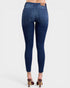 Blue jeans worn by a person on a white background