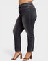 Black jeans worn by a person on a white background