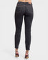 Black jeans worn by a person on a white background