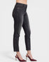 Black jeans worn by a person on a white background