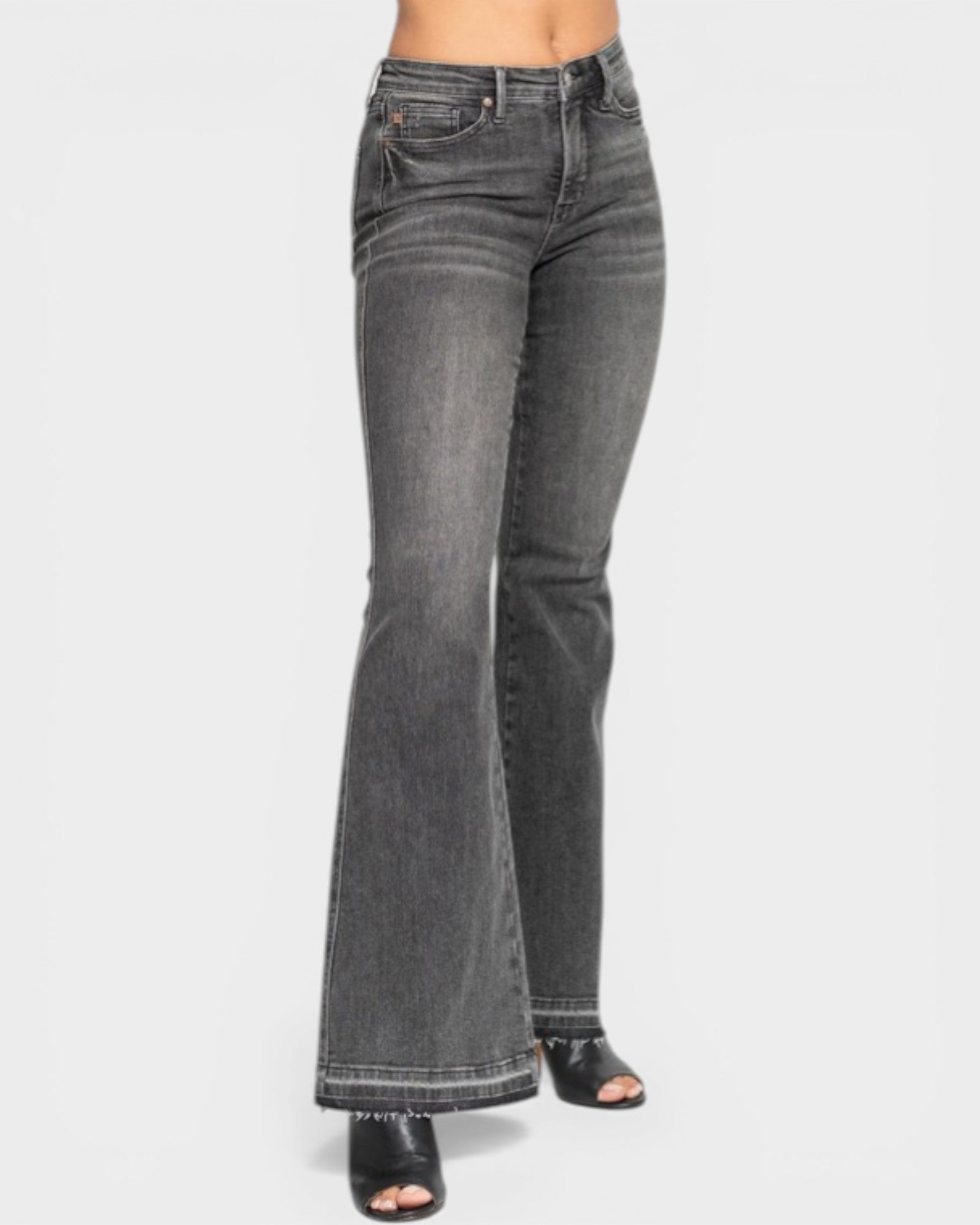 Black denim jeans on a white background