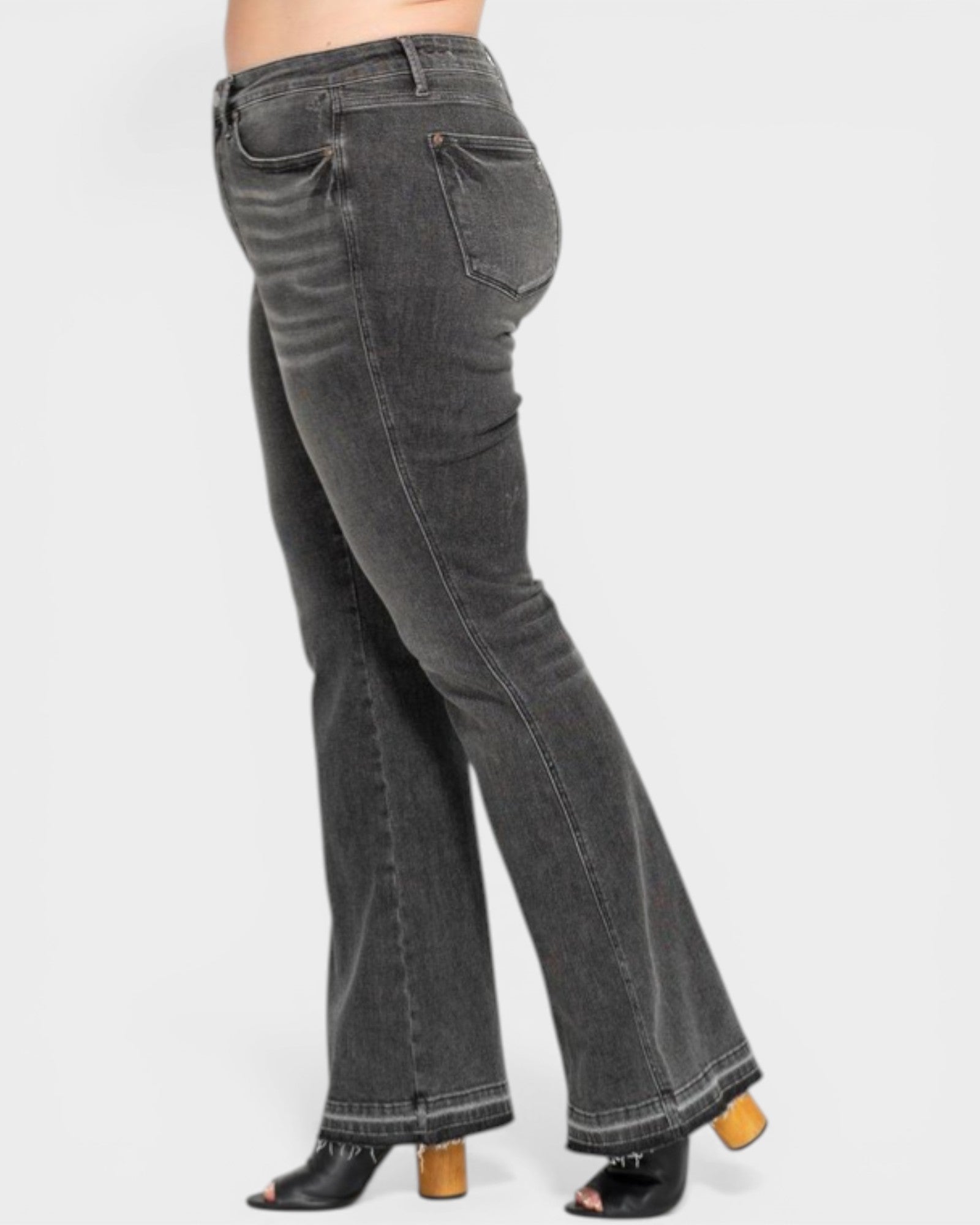 Black flared jeans on a white background
