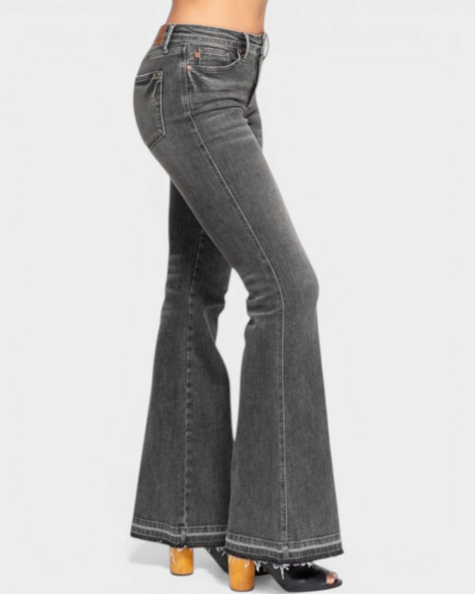 Black flared jeans on a white background