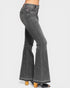 Black flared jeans on a white background
