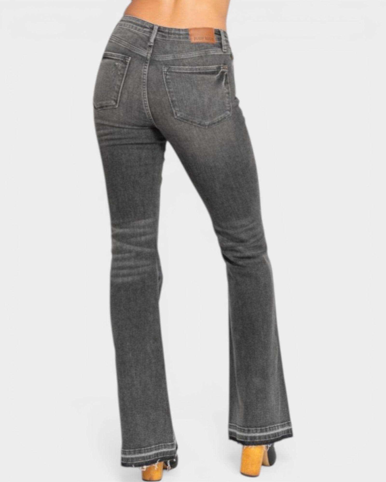 Gray flared jeans on a white background