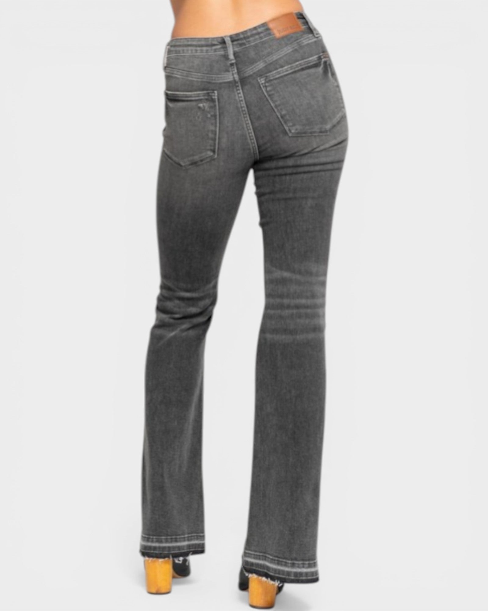 Gray flared jeans on a white background