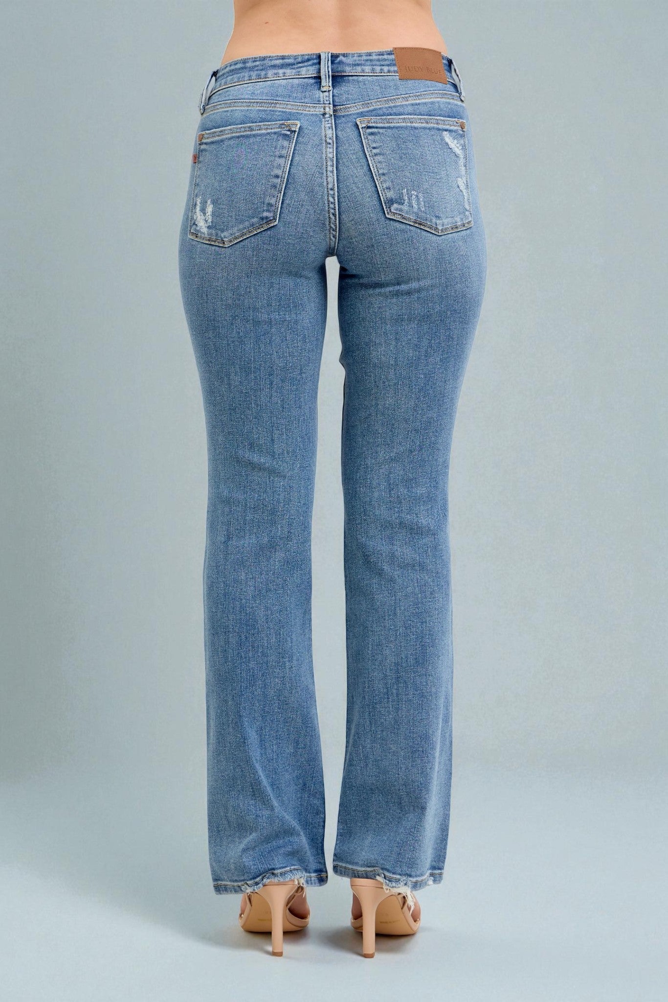 Blue jeans on a gray background