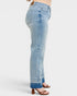 Light blue jeans worn by a person on a white background