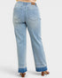 Light blue jeans worn by a person on a white background