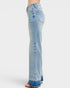 Light blue jeans with a distressed finish on a white background