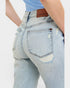 Light blue jeans with a brand label on a white background