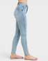 Light blue jeans worn by a person on a white background