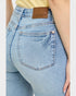 Light blue jeans with a brown patch displaying 'Judy Blue' on a plain background