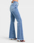Light blue flared jeans on a white background
