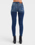 Blue jeans worn by a person on a white background