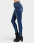 Blue jeans worn by a person on a white background