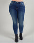 Blue jeans worn by a person on a gray background