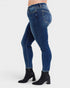 Blue jeans worn by a person on a white background