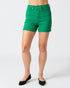 Green shorts worn by a person on a white background