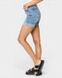 Denim shorts worn by a person on a white background