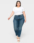 Woman wearing a white t-shirt and blue jeans on a white background