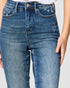Close-up of blue jeans with a plain background