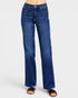 Blue jeans worn by a person on a white background