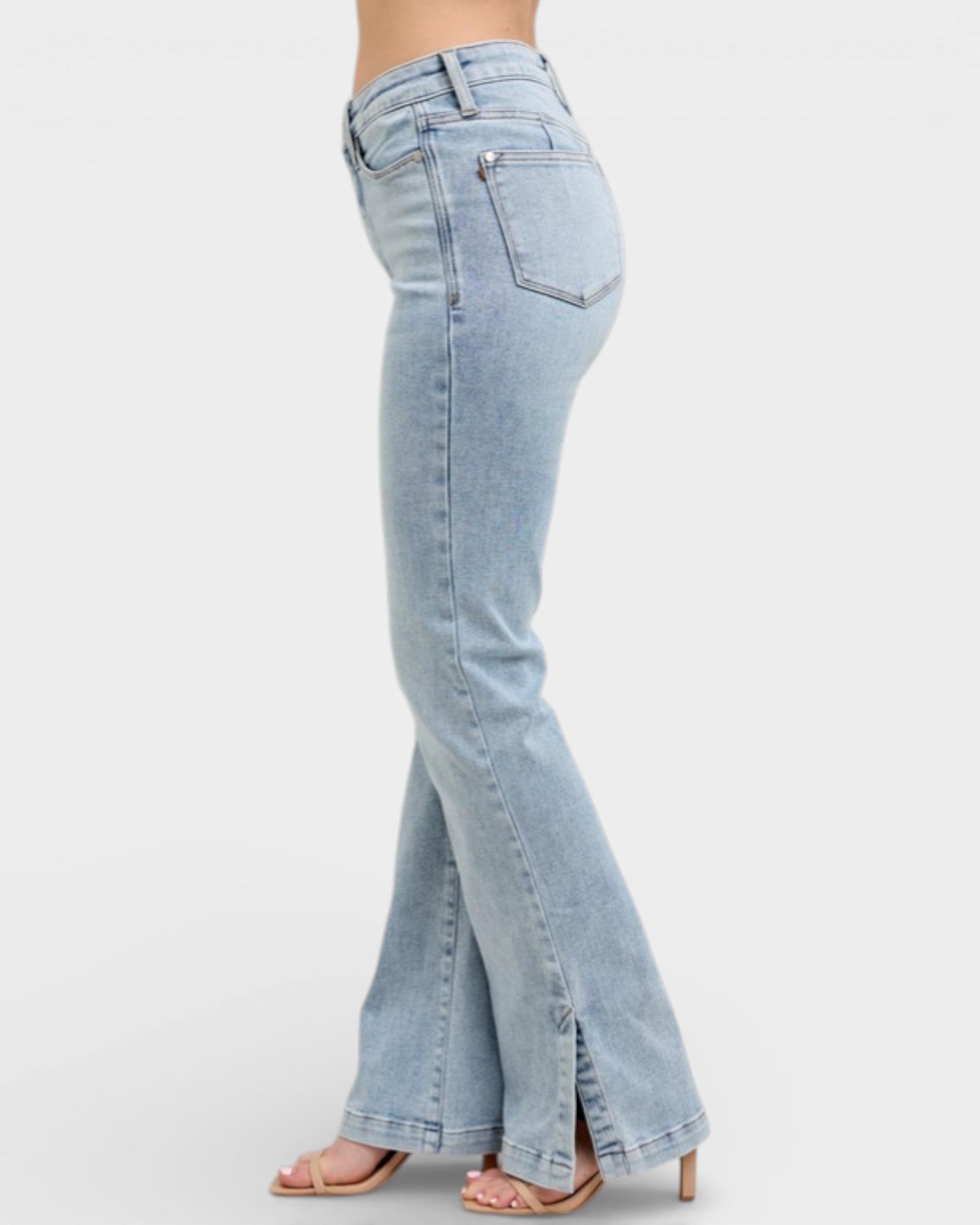 Light blue flared jeans on a white background