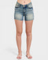 Denim shorts worn by a person on a white background