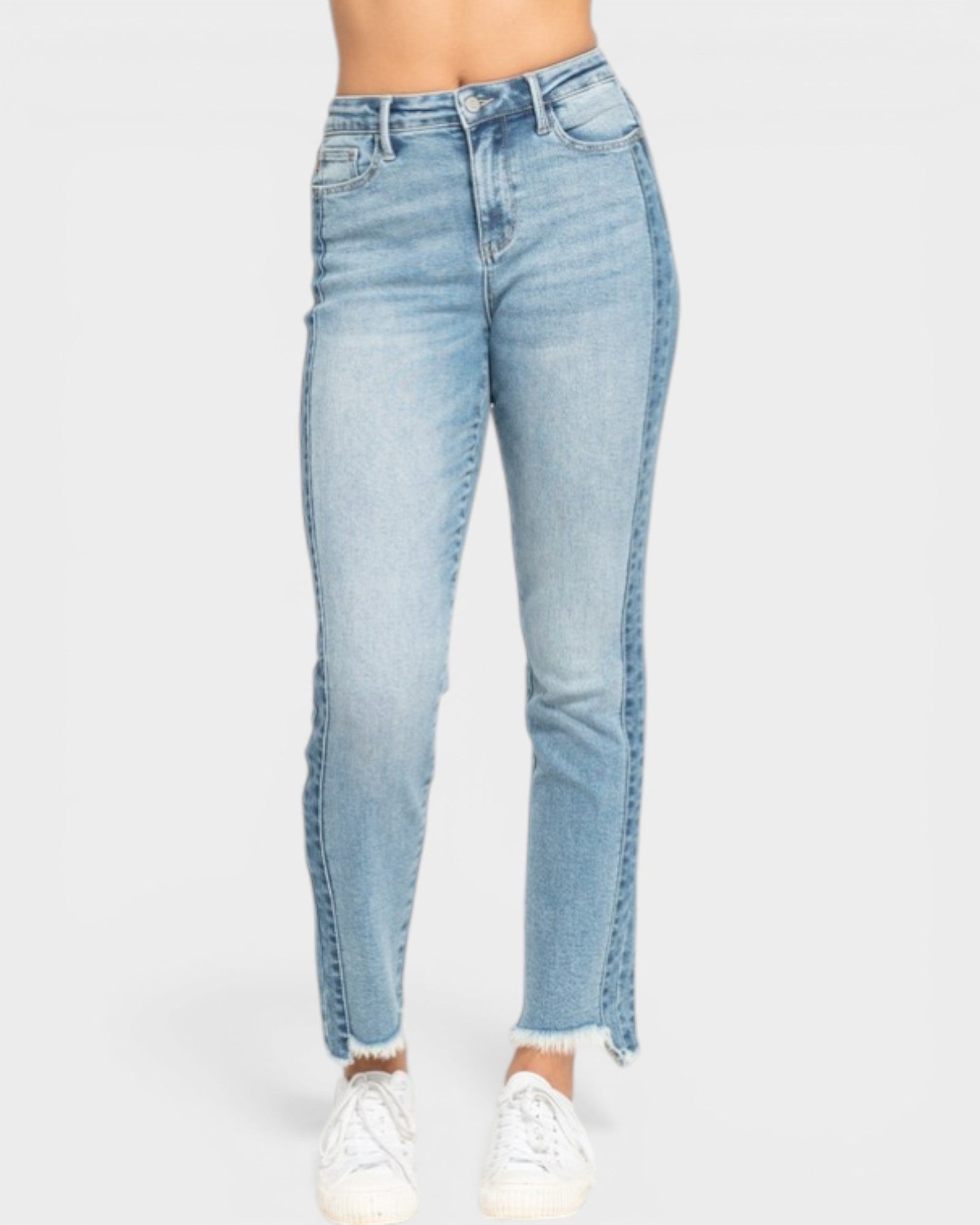 Light blue jeans with a frayed hem on a white background
