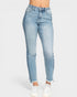 Light blue jeans worn by a person on a white background