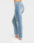 Light blue jeans worn by a person on a white background