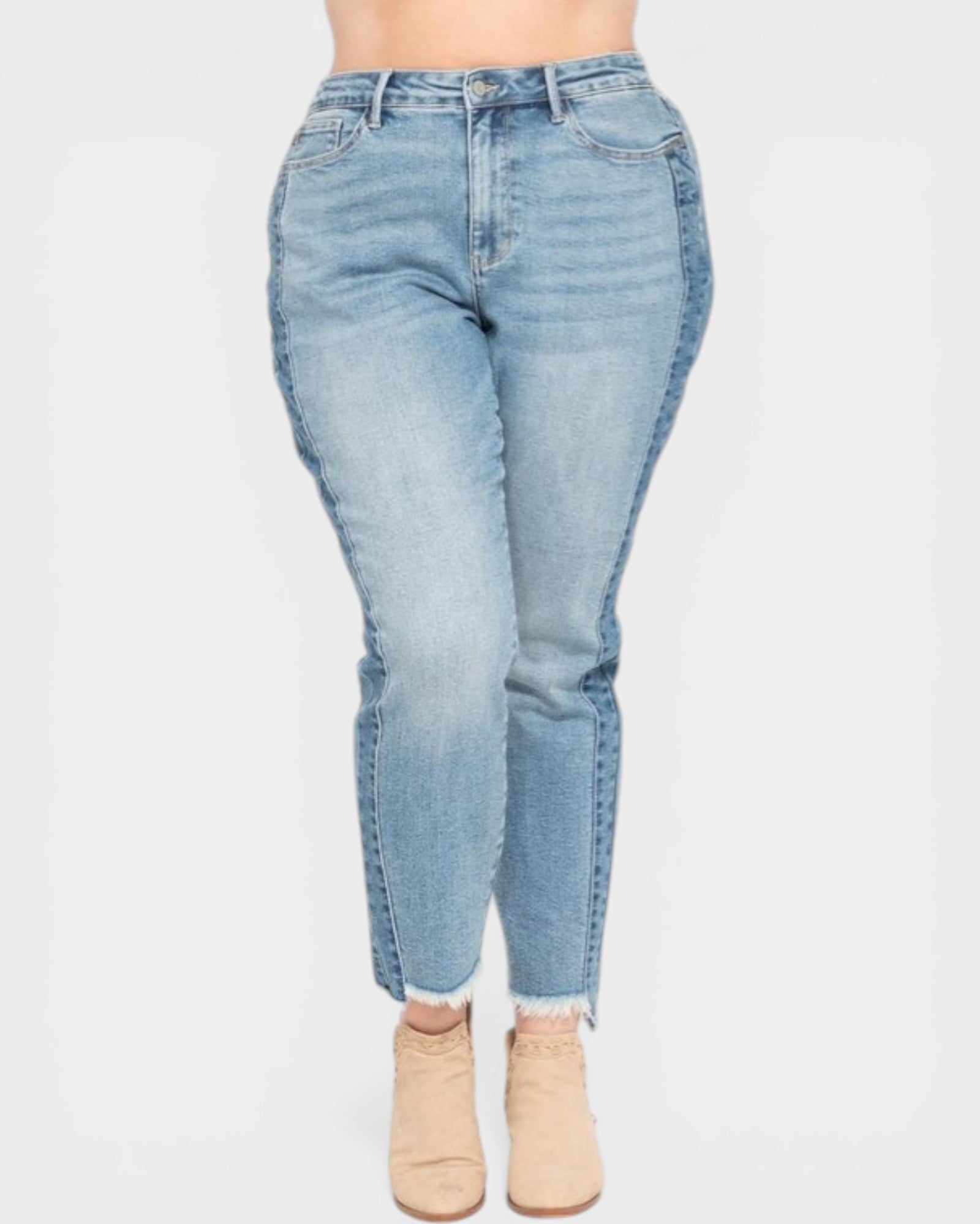Light blue jeans worn by a person on a white background