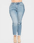Light blue jeans worn by a person on a white background