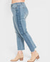 Light blue jeans worn by a person on a white background