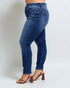 Blue jeans worn by a person on a white background