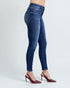 Blue jeans worn by a person on a white background