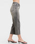 Person wearing gray jeans on a white background