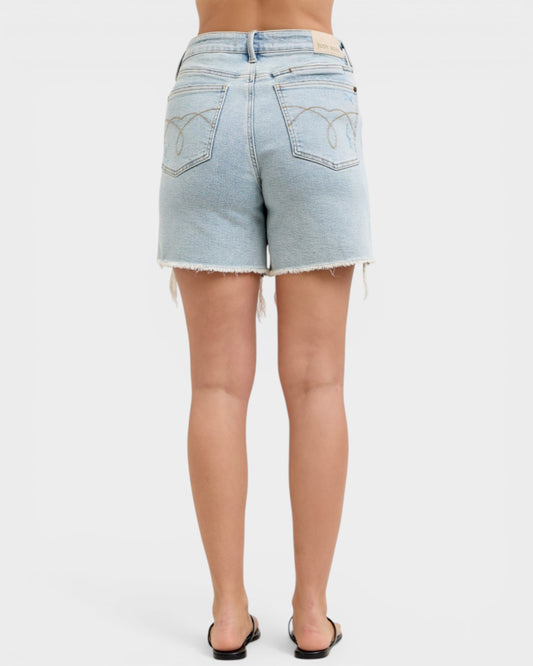Light blue denim shorts worn by a person on a white background