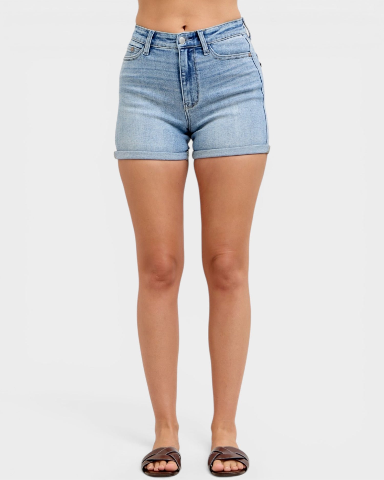 Light blue denim shorts worn by a person on a white background