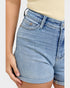 Light blue denim shorts worn by a person on a white background