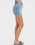 Light blue denim shorts worn by a person on a white background