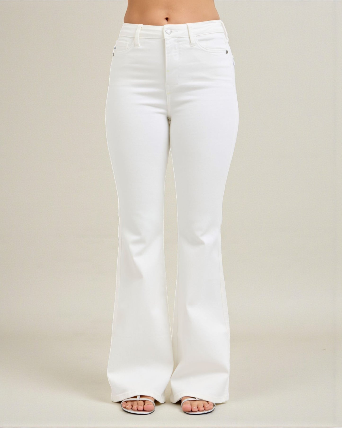 White jeans worn by a person on a plain background