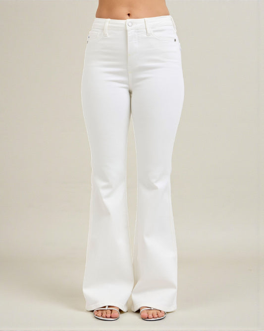 White jeans worn by a person on a plain background