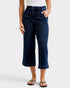 Person wearing dark blue jeans on a white background