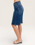 Blue denim shorts worn by a person on a white background