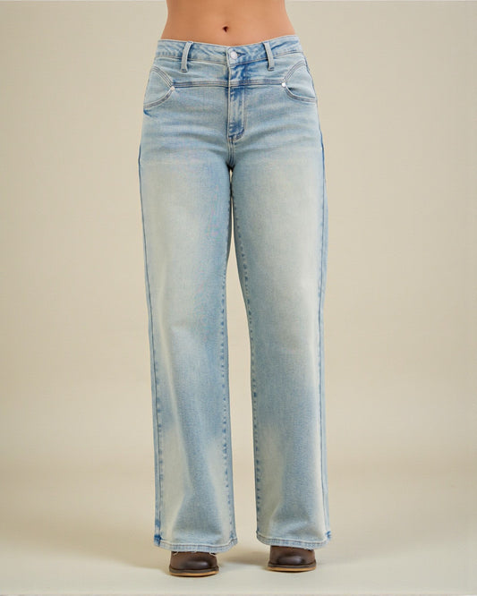 Light blue jeans on a beige background
